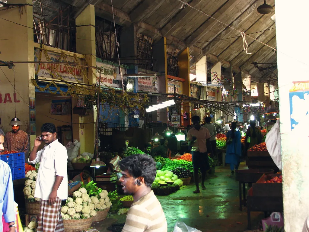 Traders and buyers in the vegetable halls of Koyambedu wholesale market, Chennai